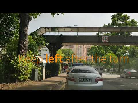 Video still showing the approach road with the instruction to keep left after the turn